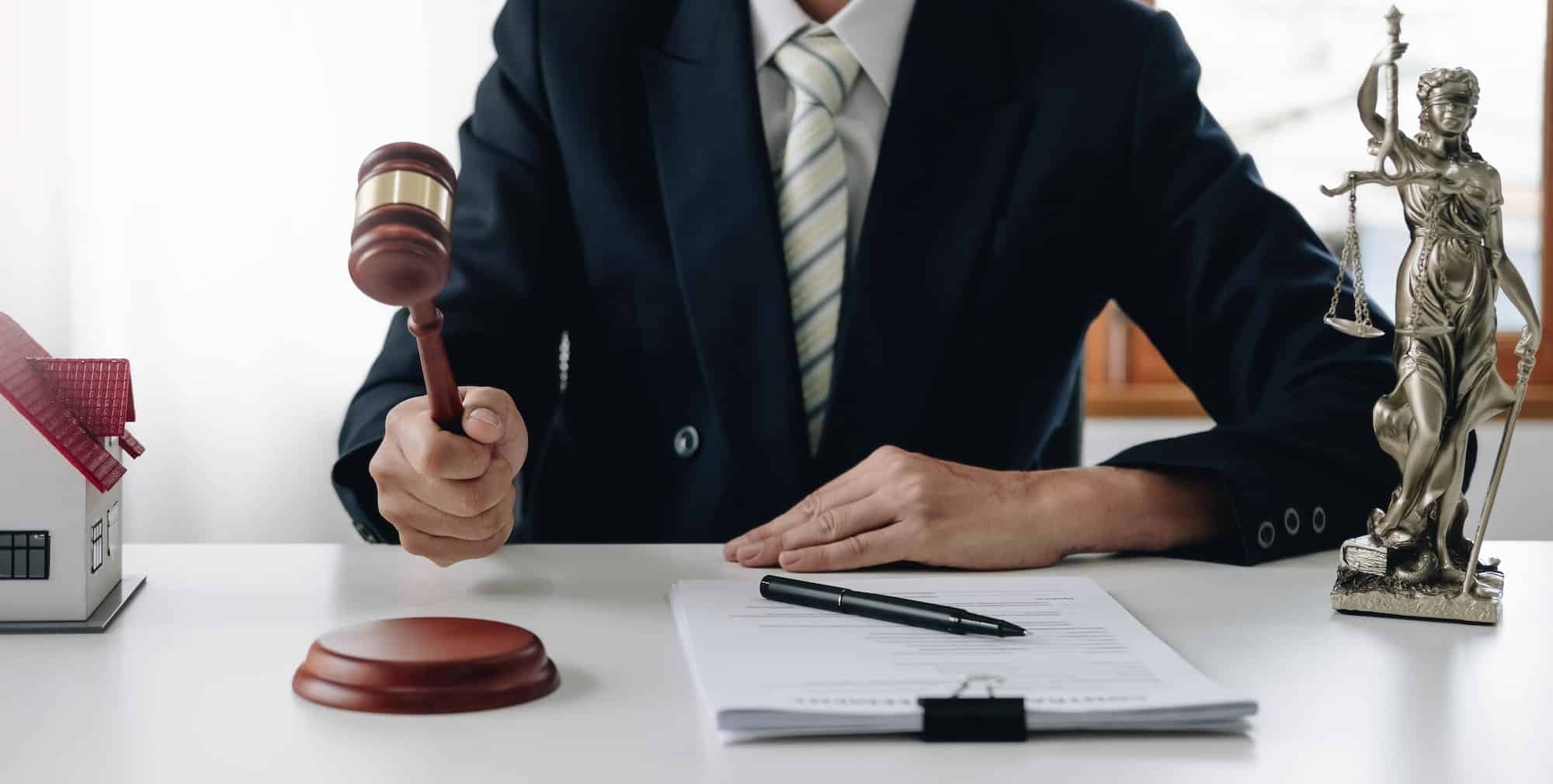lawyer-or-judge-holding-hammer-prepares-to-judge-the-case-with-justice-and-litigation-scales-of.jpg