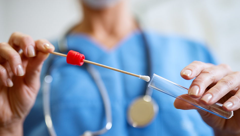 medical professional working with dna swab