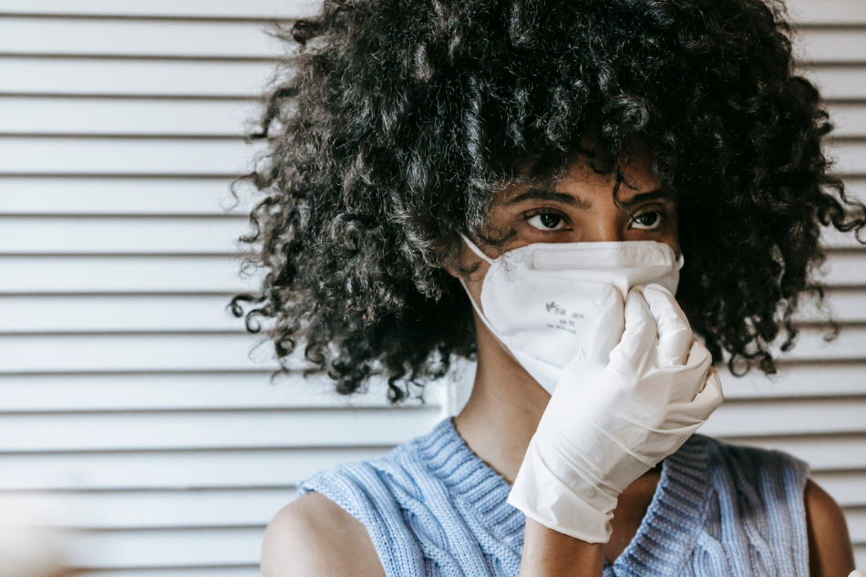 black woman wearing mask and gloves