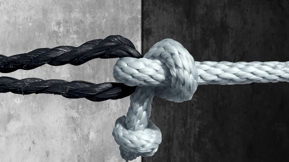 black and white rope knotted and pulled against each other