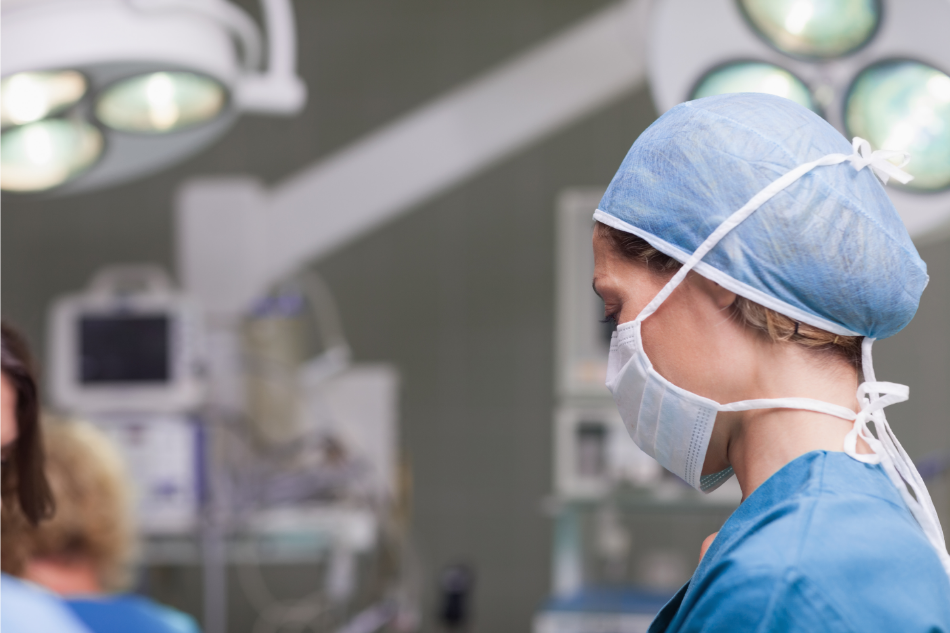 nurse wearing mask in operating room